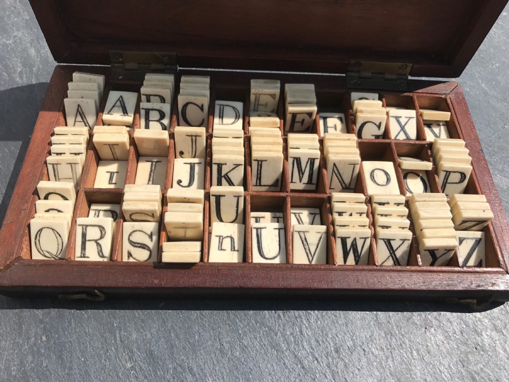 An unusual 19th century mahogany boxed set of bone letters- for learning to  spelling View III