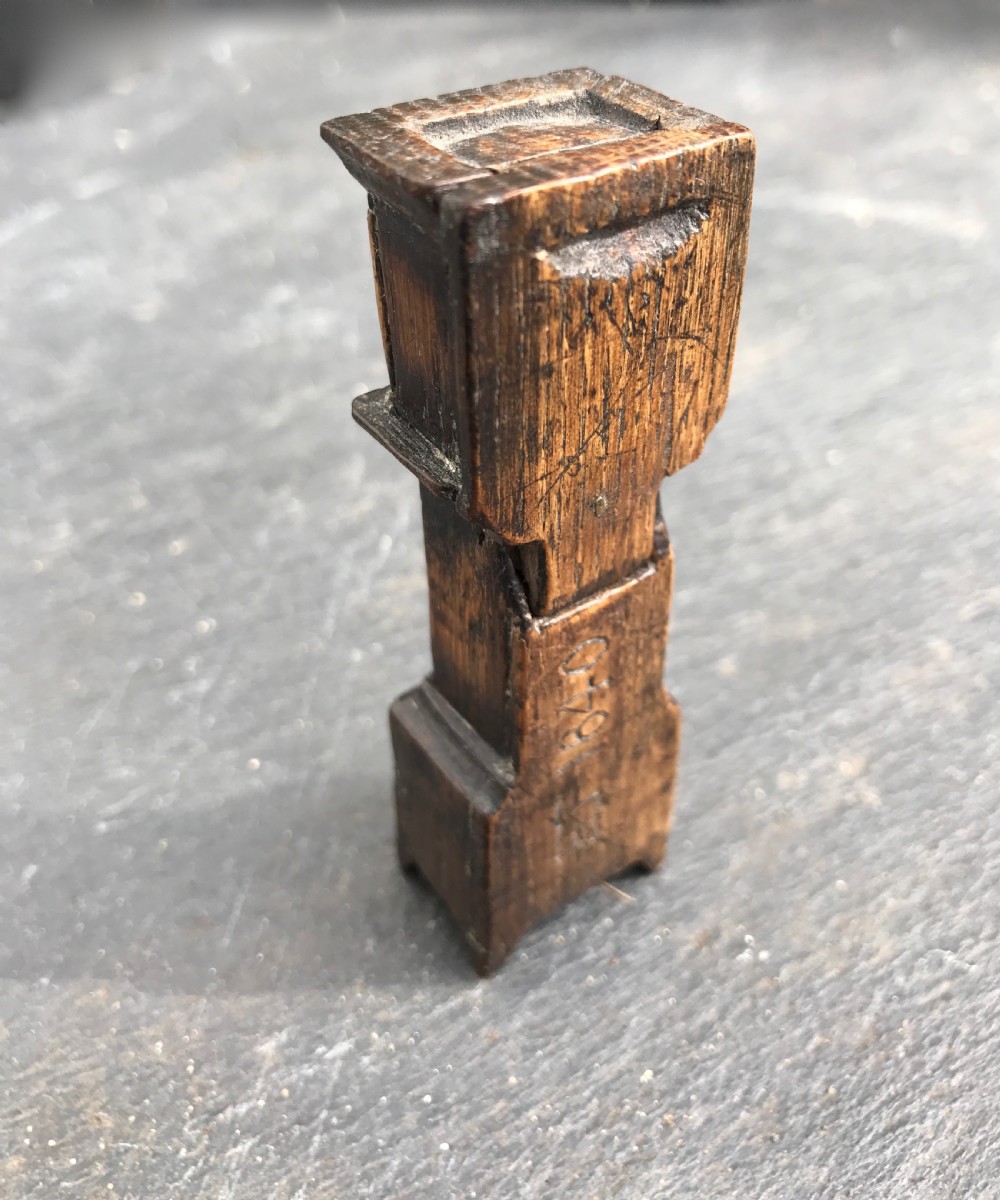 An antique snuff box in the form of a small grandfather  View II