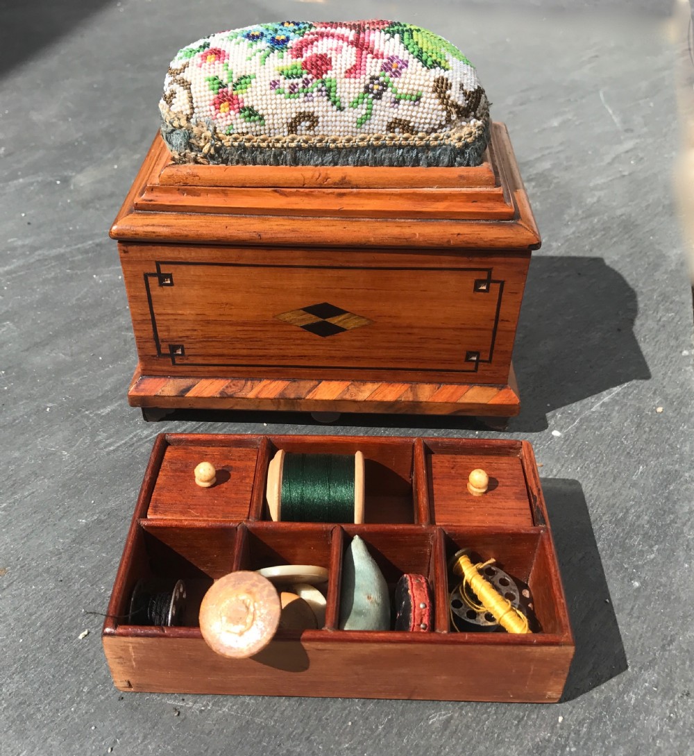 A Victorian miniature sewing box with bead work pin cushion top  View II