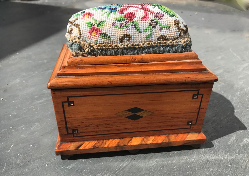 A Victorian miniature sewing box with bead work pin cushion top  View V