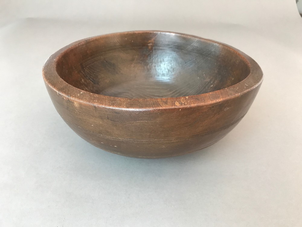 A large antique Welsh elm bowl 