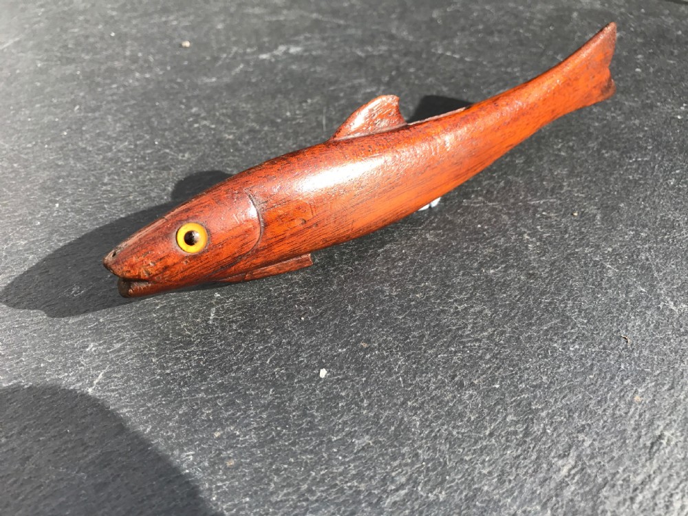 A 19th century mahogany knitting sheath in the shape of a fish
