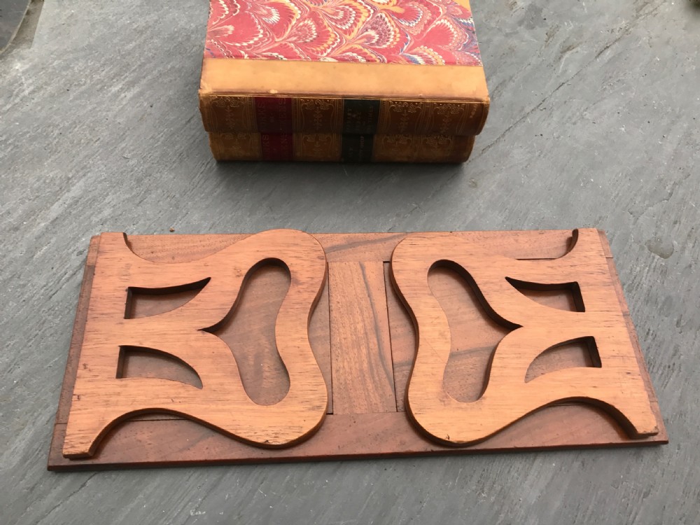 An antique Victorian extending book slide made from walnut 