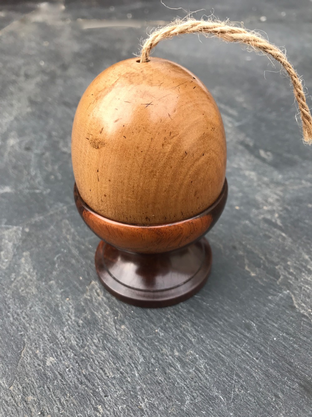 An antique novelty string box in the form of an egg cup or acorn!