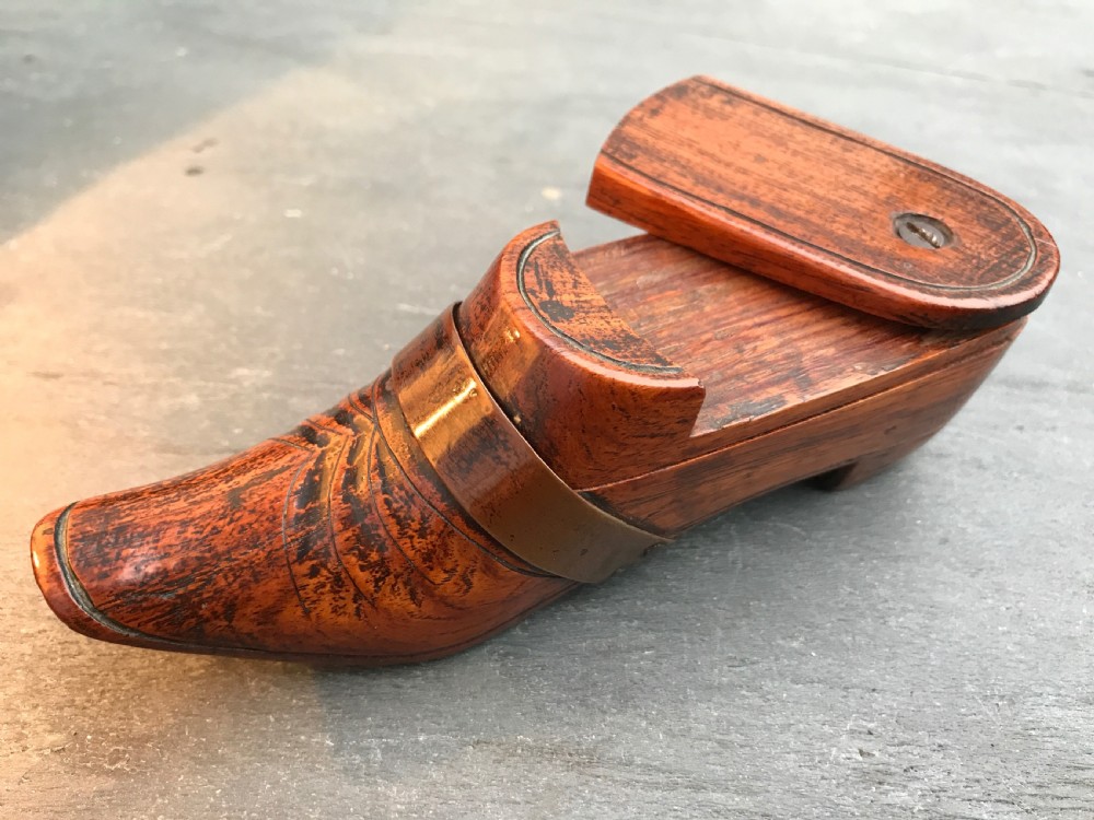 A lovely fruitwood antique treen puzzle snuff shoe with a lovely copper strap to the front View III