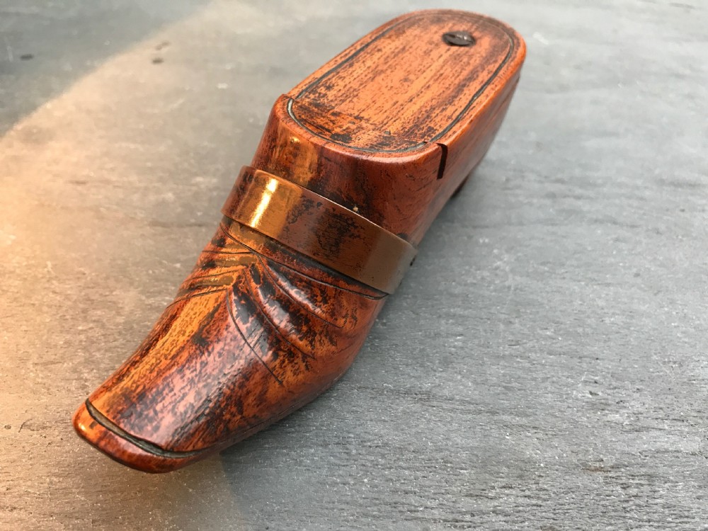 A lovely fruitwood antique treen puzzle snuff shoe with a lovely copper strap to the front View IV