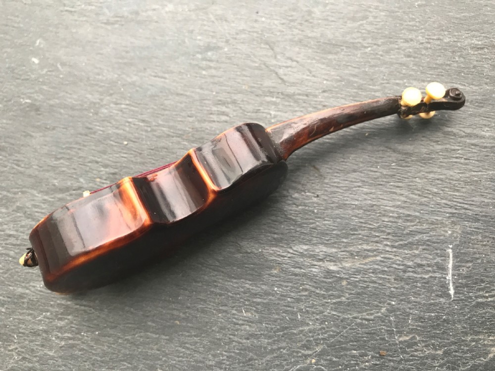 An antique 19th century tortoiseshell novelty tape measure  View III