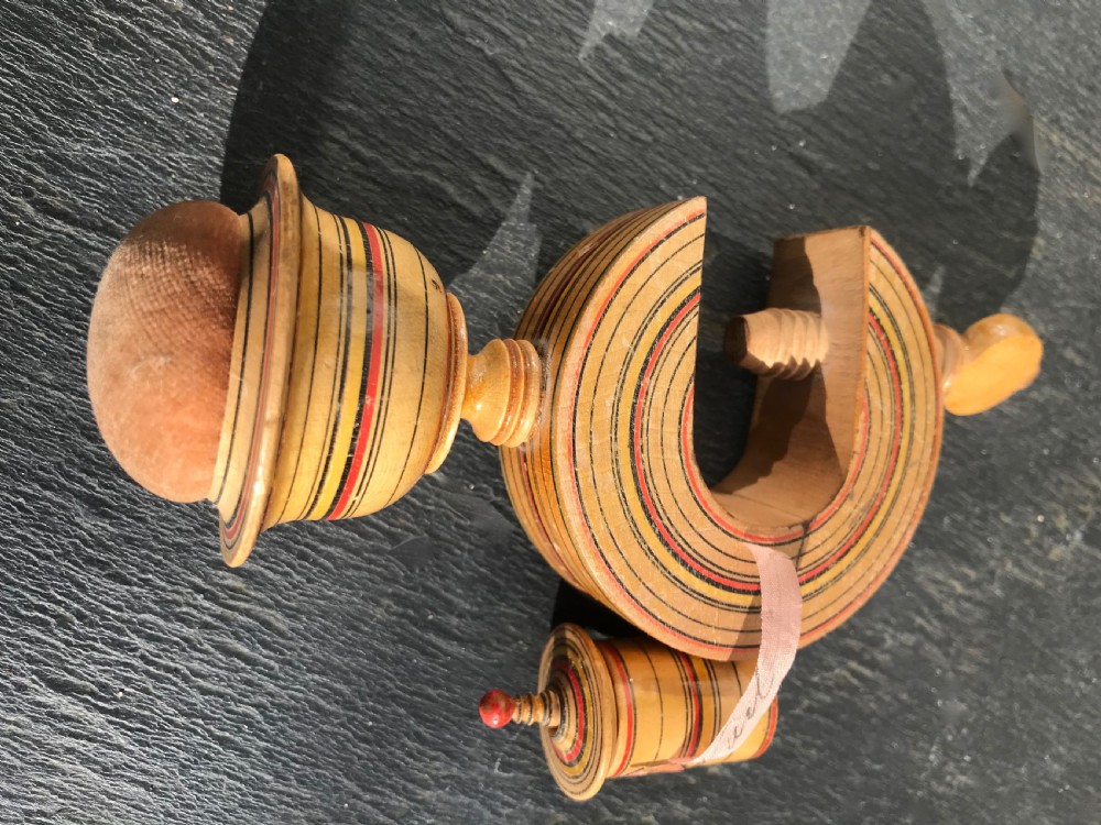 An early 19th century painted Tunbridge Ware sewing clamp, pin cushion and tape measure View III