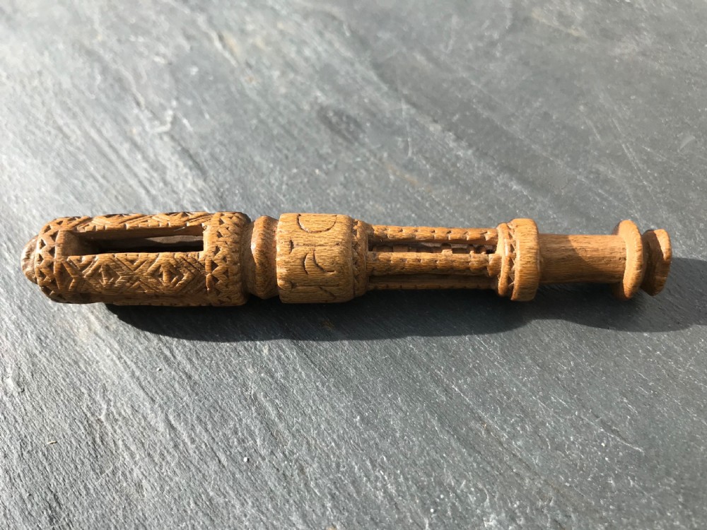 An unusual  fruitwood  lace bobbin dated 1828 - chip carved/balls/lantern