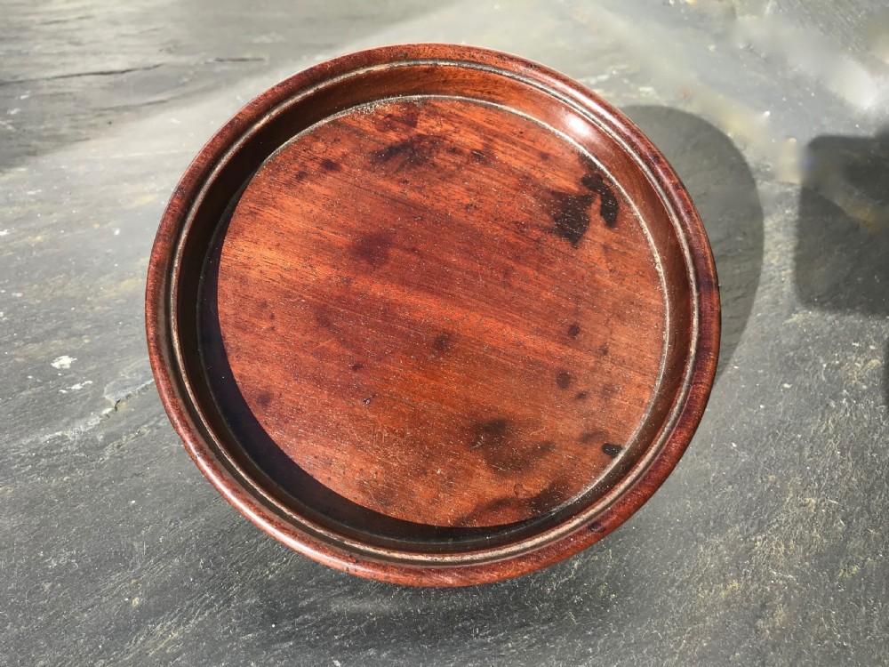 A fine early 19th century mahogany wine coaster  View II