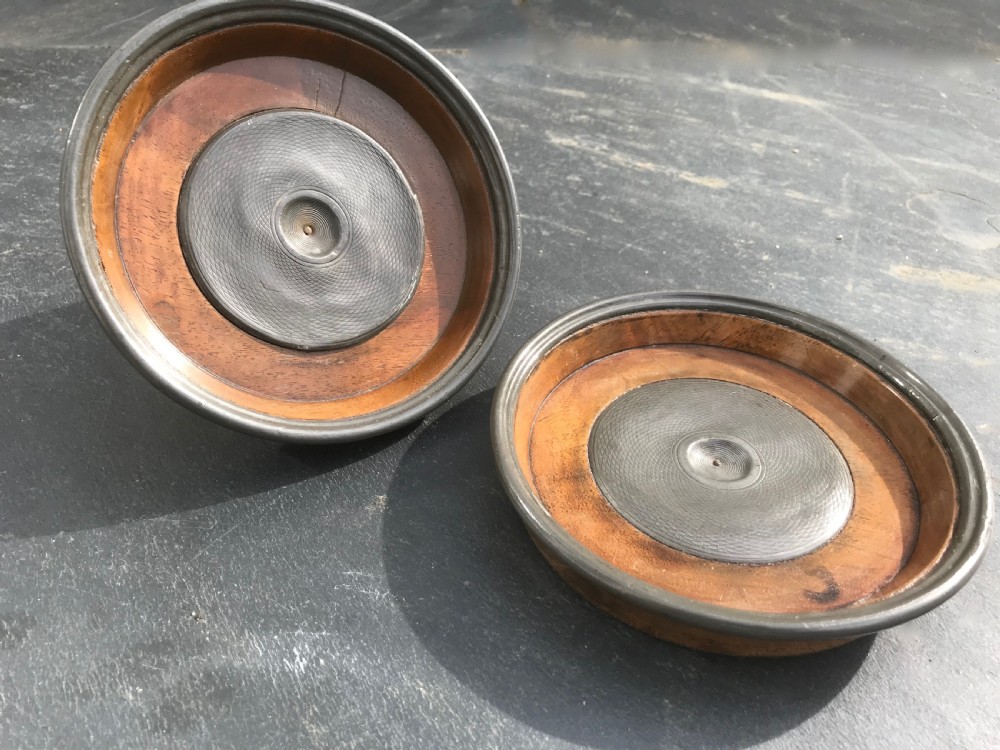 A very unusual pair of early19th century wine coasters