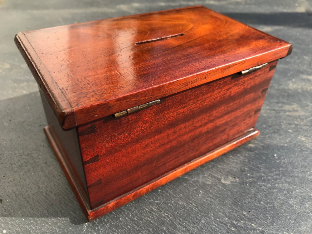An antique money box in the form of a chest View II