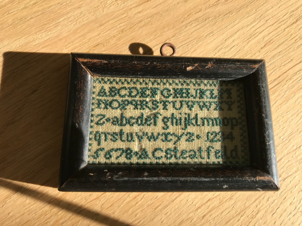 An unusually small 19th century sampler View II