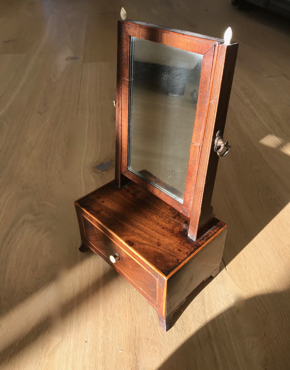 A RARE small size George III  flame mahogany dressing mirror 