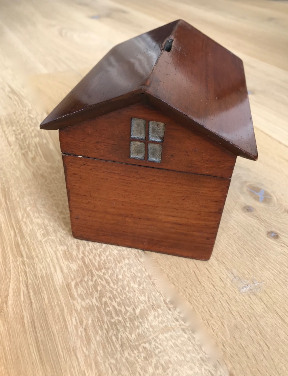 An unusual mahogany money box in the shape of a house - treen View III