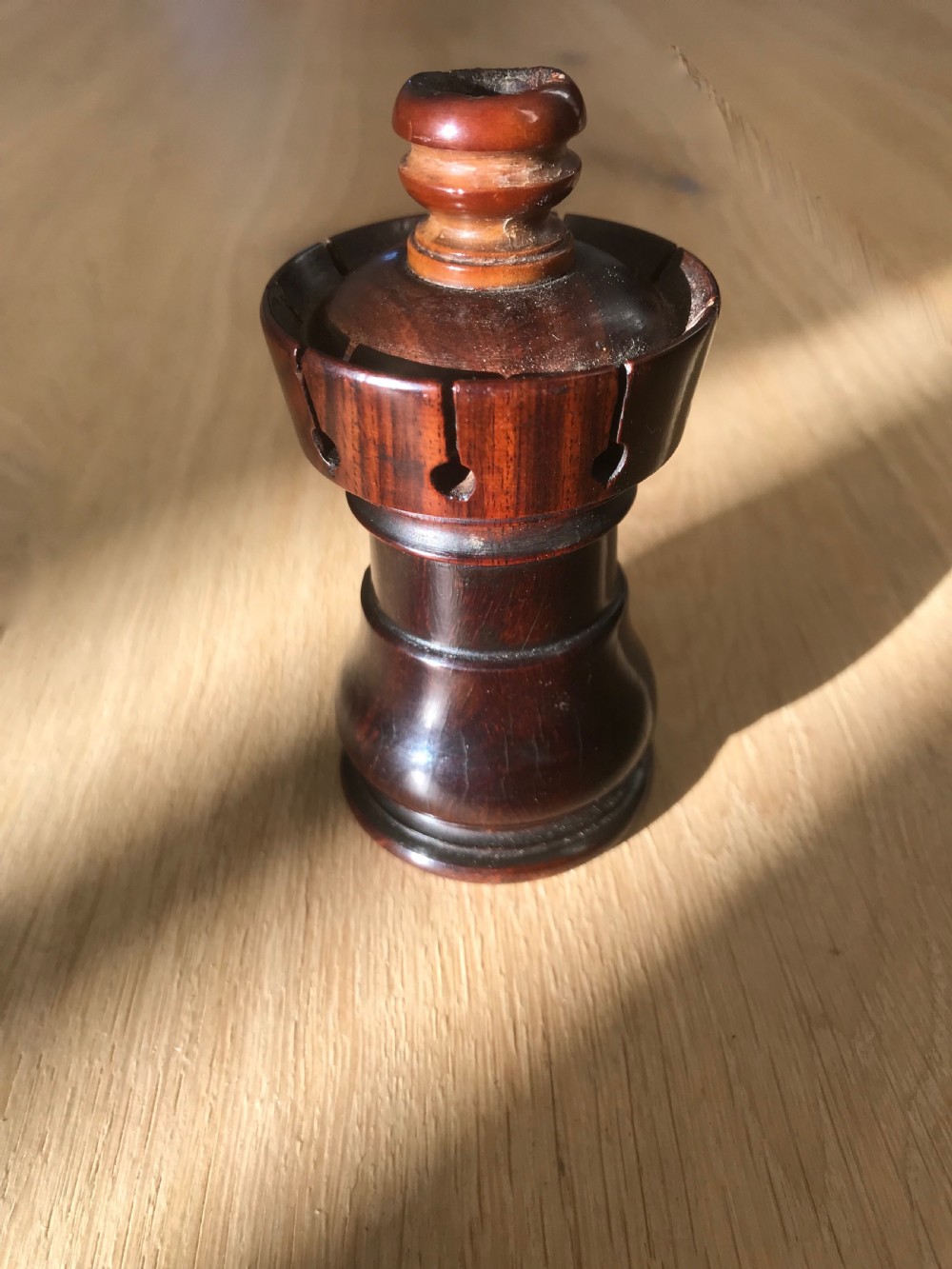 An antique lignum vitae 'Go to Bed' and Candle Holder - treen