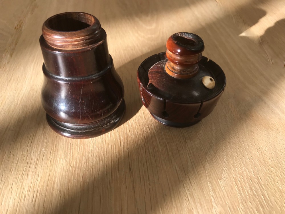 An antique lignum vitae 'Go to Bed' and Candle Holder - treen View II