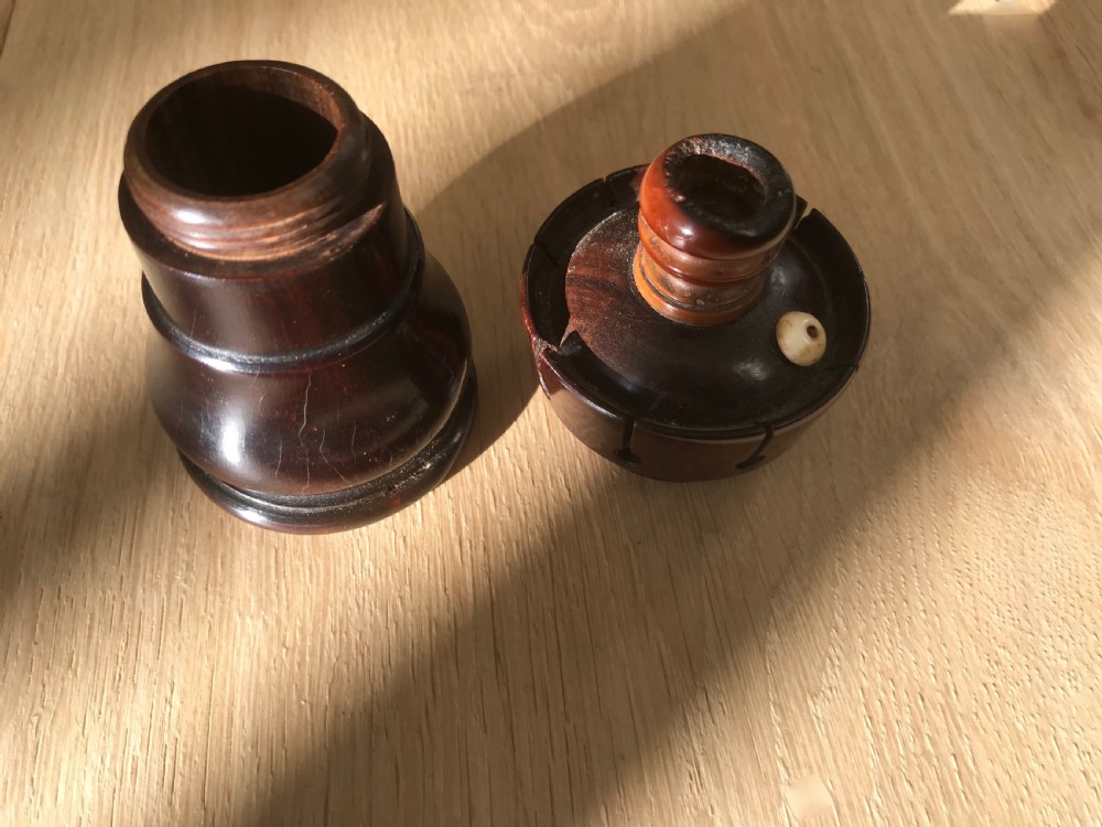 An antique lignum vitae 'Go to Bed' and Candle Holder - treen View III
