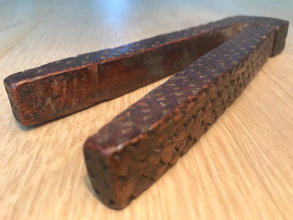An antique treen English lever nutcracker dated 1791 