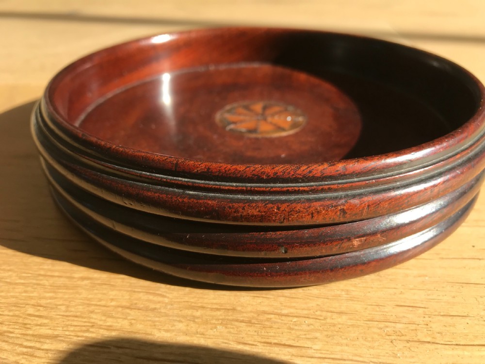 A George III mahogany wine coaster  - treen