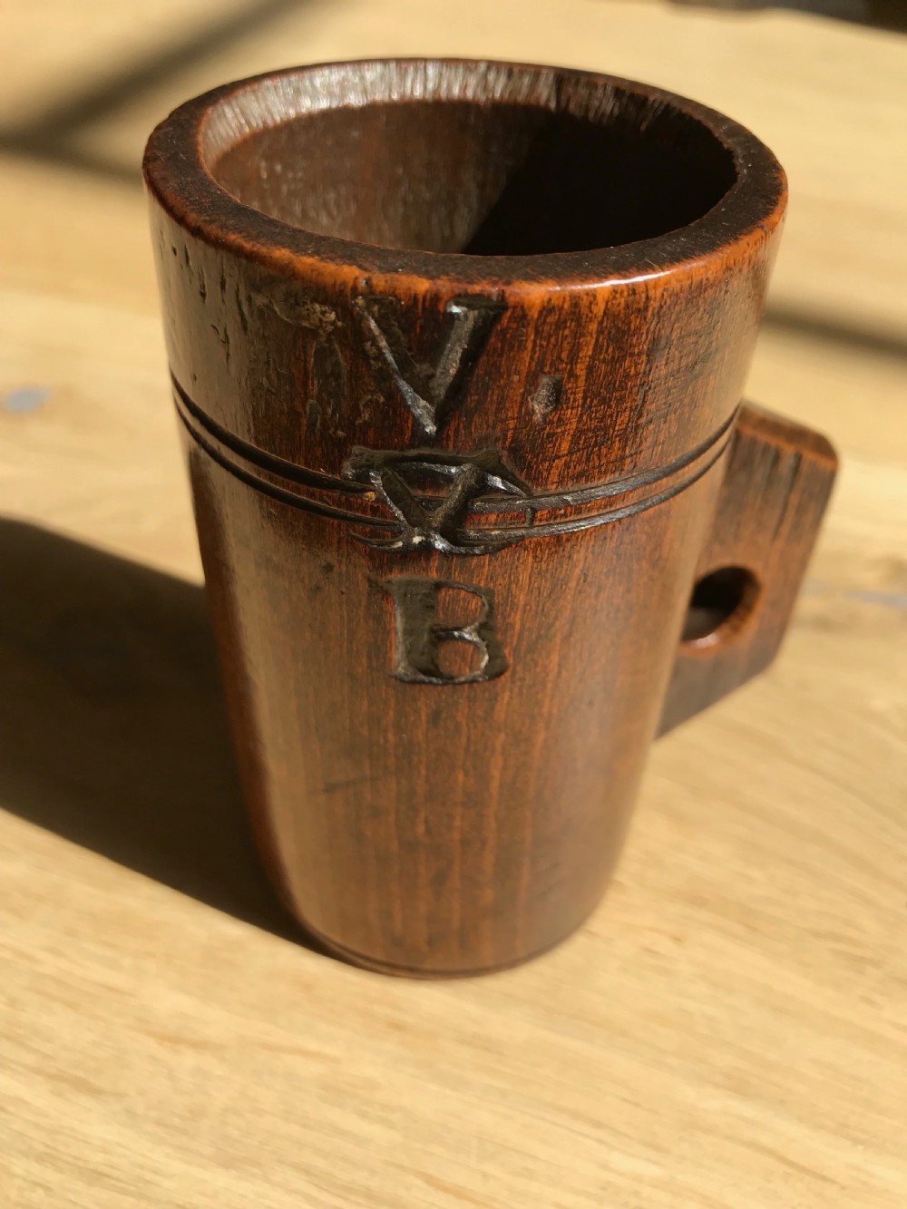 An unusually  small Victorian beechwood measure