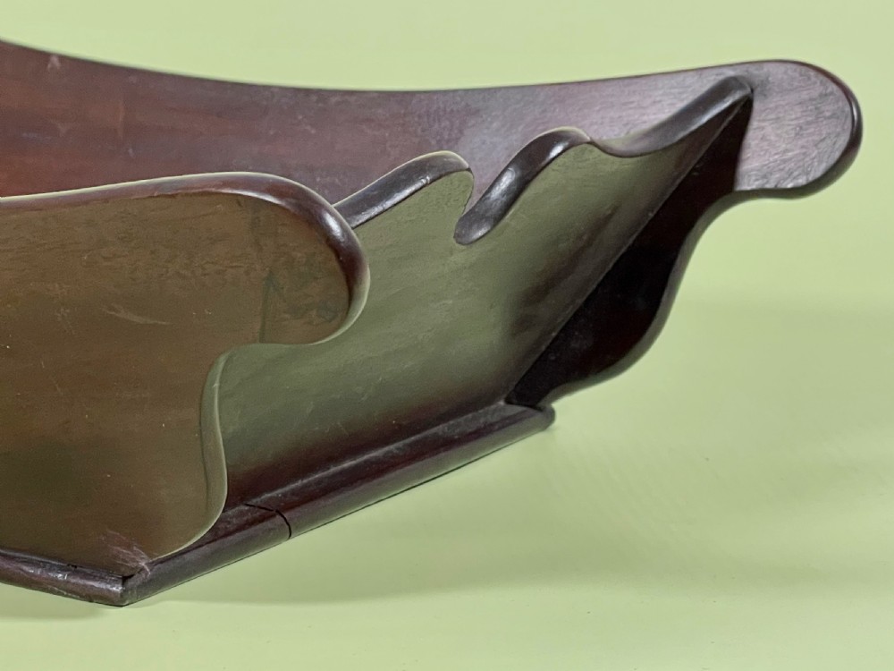 A Georgian mahogany deep wooden container featuring flared scalloped side rims and a rectangular base. View II