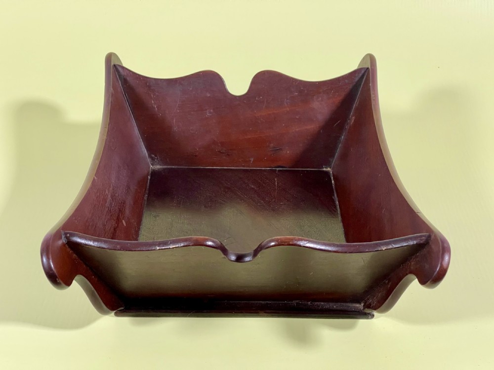 A Georgian mahogany deep wooden container featuring flared scalloped side rims and a rectangular base. View VIII