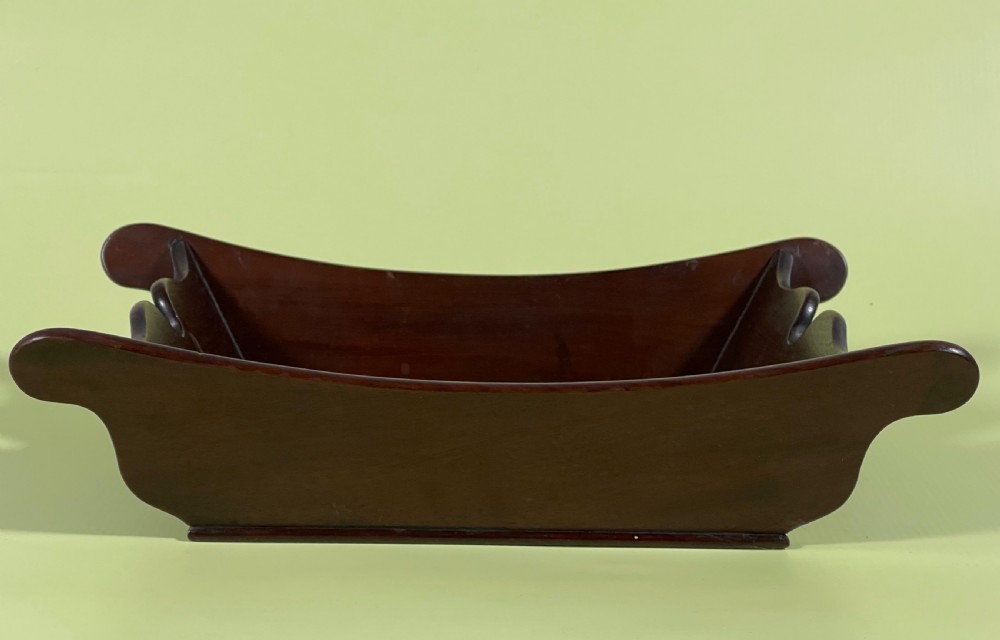 A Georgian mahogany deep wooden container featuring flared scalloped side rims and a rectangular base. View XI
