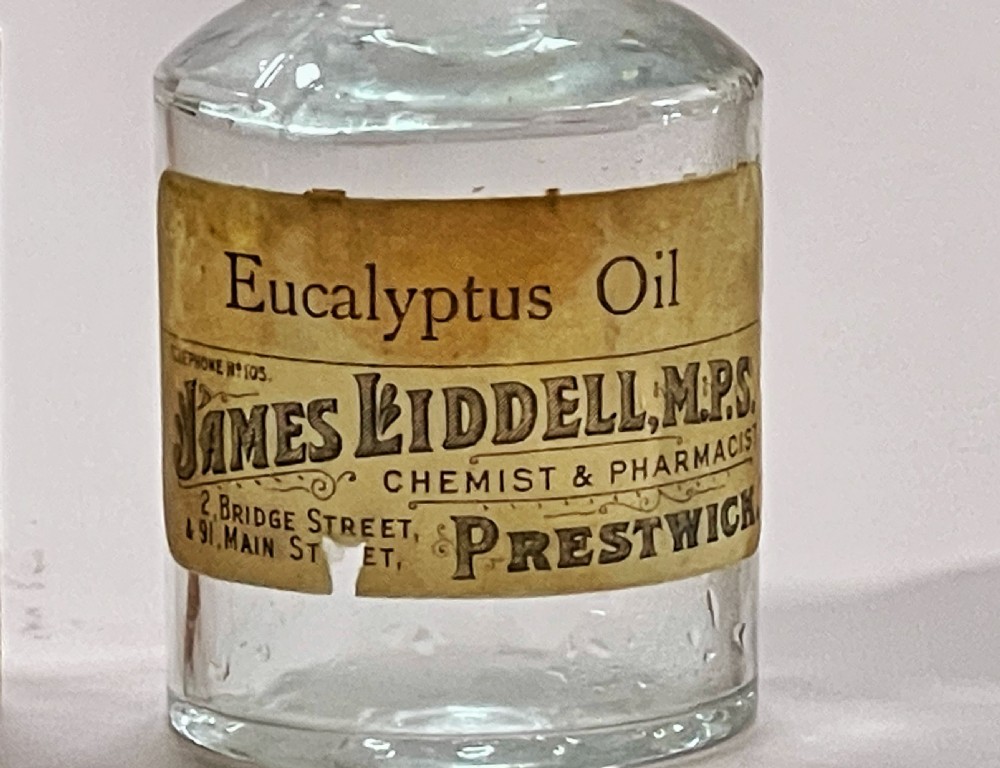 Antique Bottle Case & Bottle still retaining the original label View II