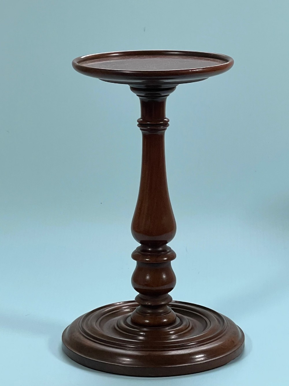 A Georgian Mahogany Candle Stand - lead weighted