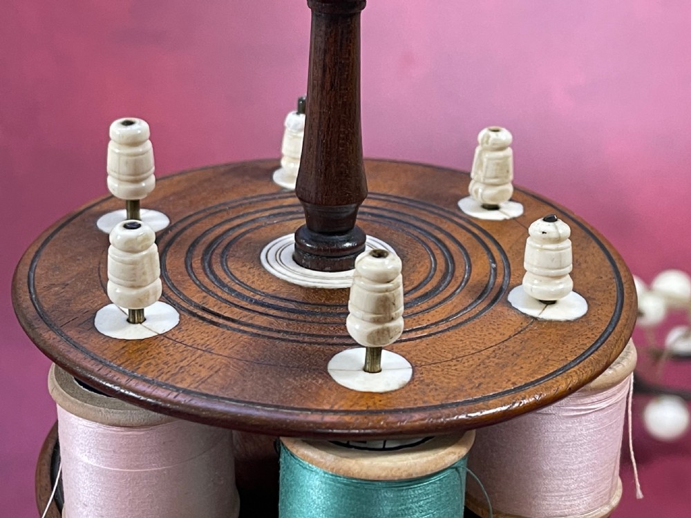 An Early !800s Mahogany Reel Stand - includes 18 cotton reels View II