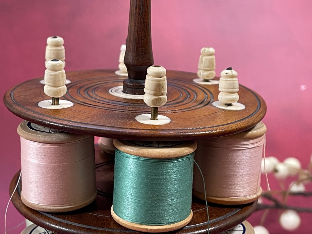 An Early !800s Mahogany Reel Stand - includes 18 cotton reels View III