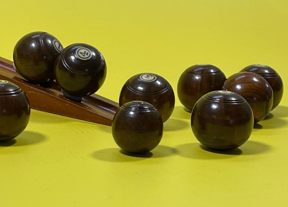 A Complete Set of Mini Lignum Vitae Bowls & Jack