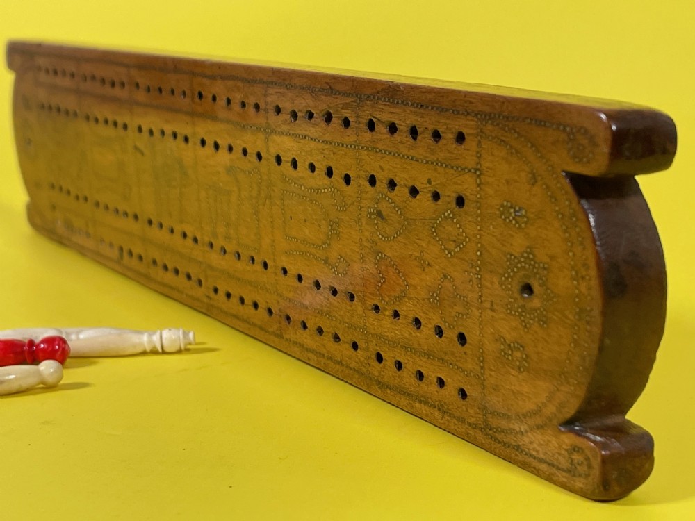 An Unusual Cribbage Board - with hearts, clubs, diamonds, spades  goblets, jugs and dated