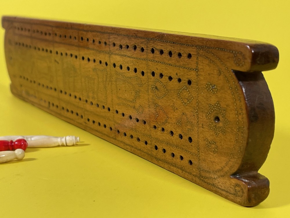 An Unusual Cribbage Board - with hearts, clubs, diamonds, spades  goblets, jugs and dated View II