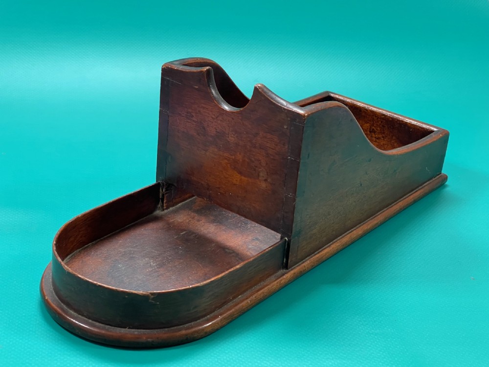 A Georgian mahogany wine bottle slope or cradle View IV