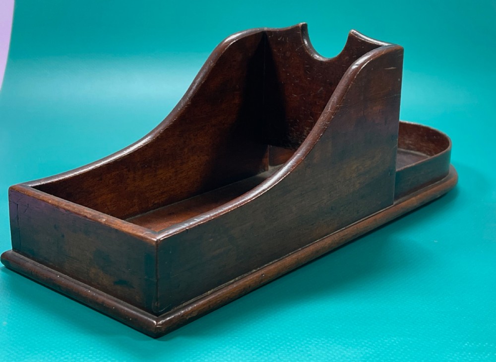 A Georgian mahogany wine bottle slope or cradle View VII