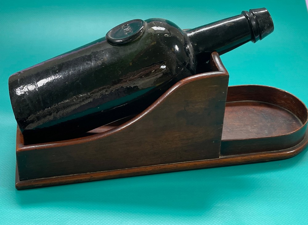 A Georgian mahogany wine bottle slope or cradle View IX