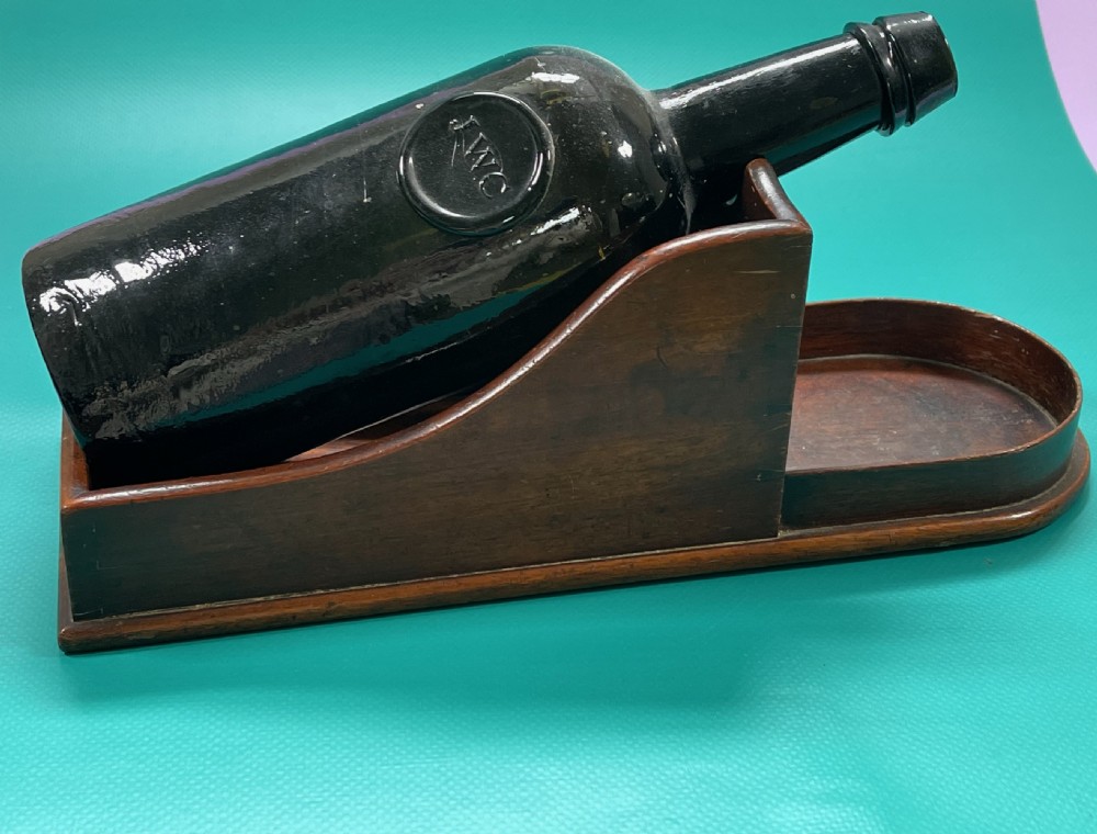 A Georgian mahogany wine bottle slope or cradle View X