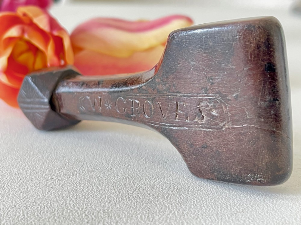A very good antique treen sailor's rubber - faceted handle View II