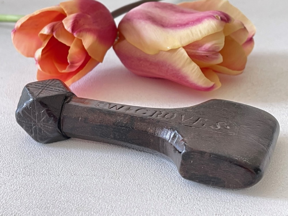 A very good antique treen sailor's rubber - faceted handle View VI