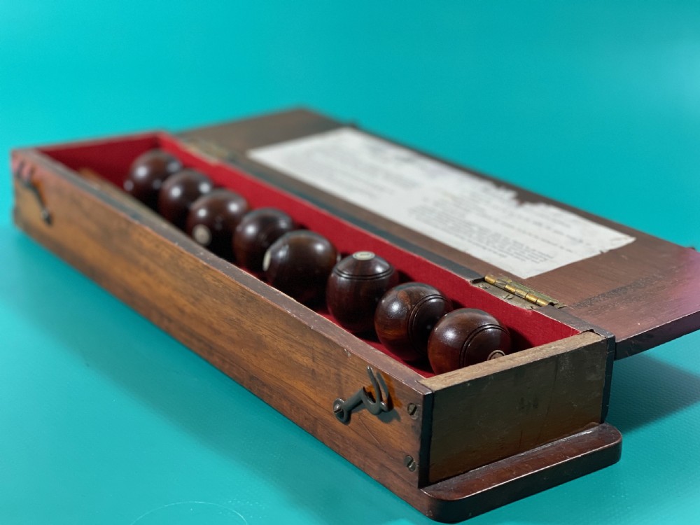 Antique treen Table bowls in a Mahogany Box - complete with rules View VII