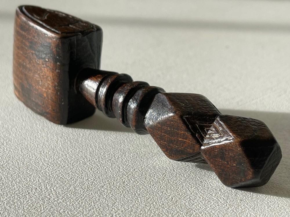An Antique Treen Folk Art sailors seam rubber