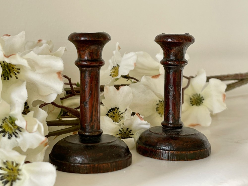 A Pair Of Antique Treen Taper Candlesticks View II