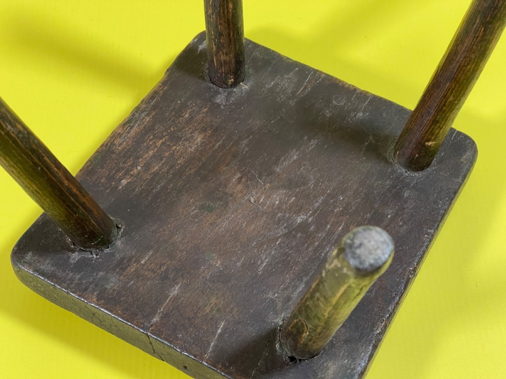 An Antique Stool with remnants of the old green paint View II