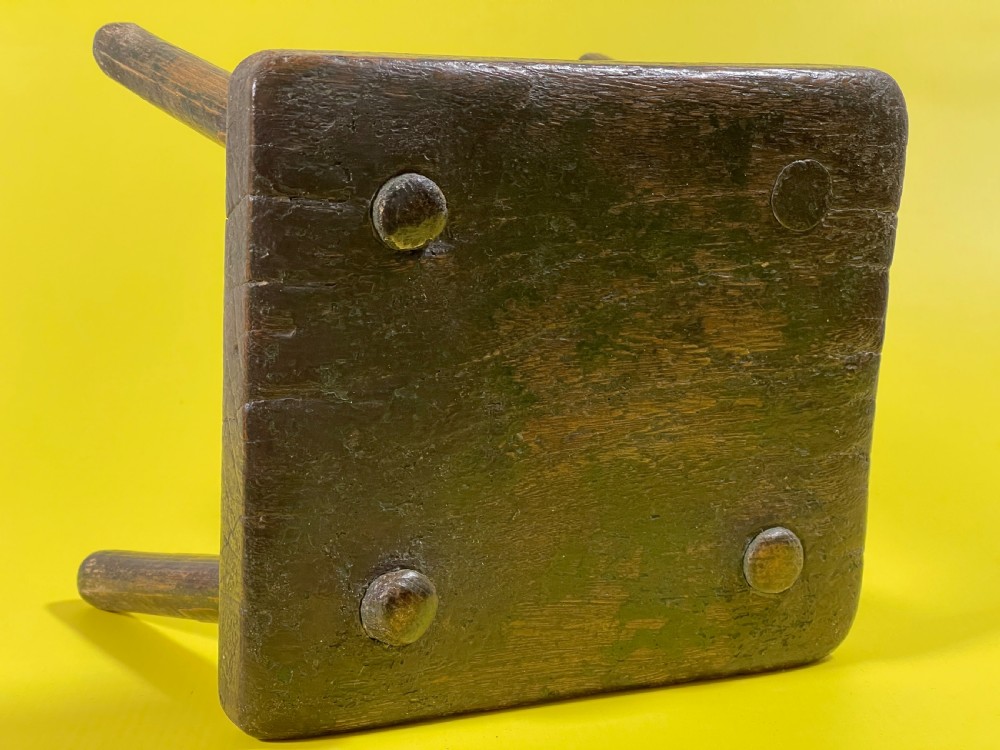 An Antique Stool with remnants of the old green paint View IV