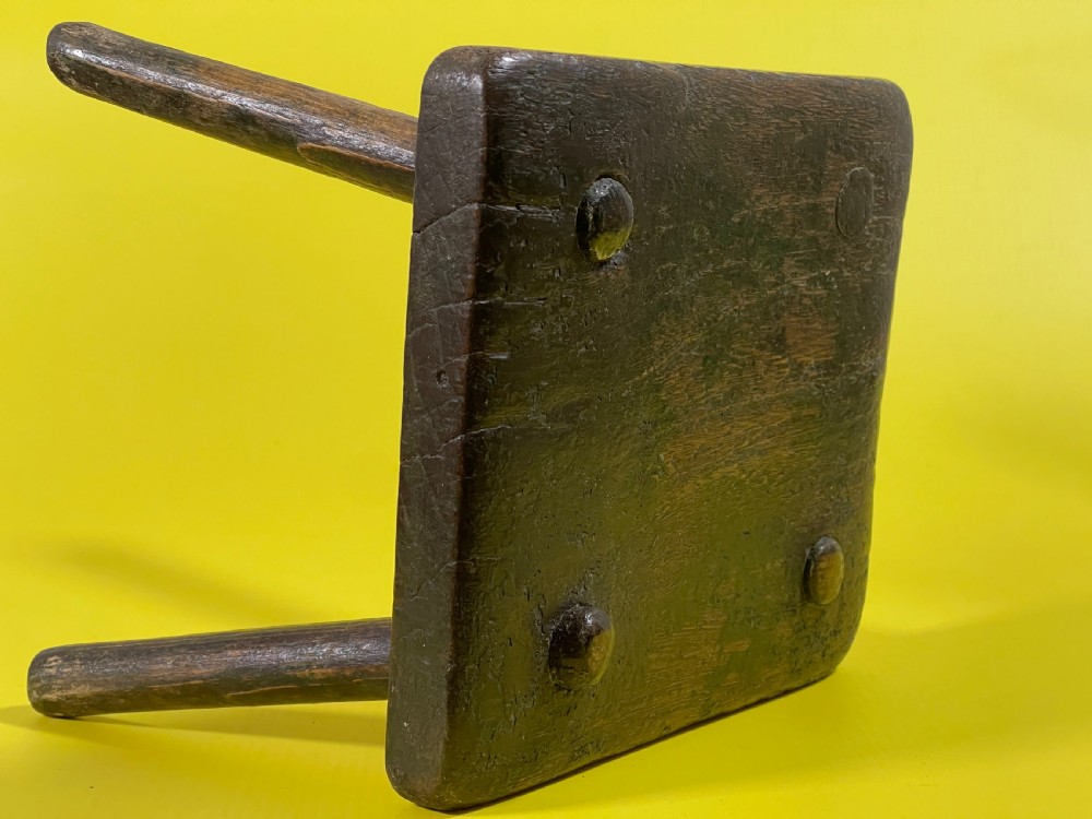 An Antique Stool with remnants of the old green paint View VI