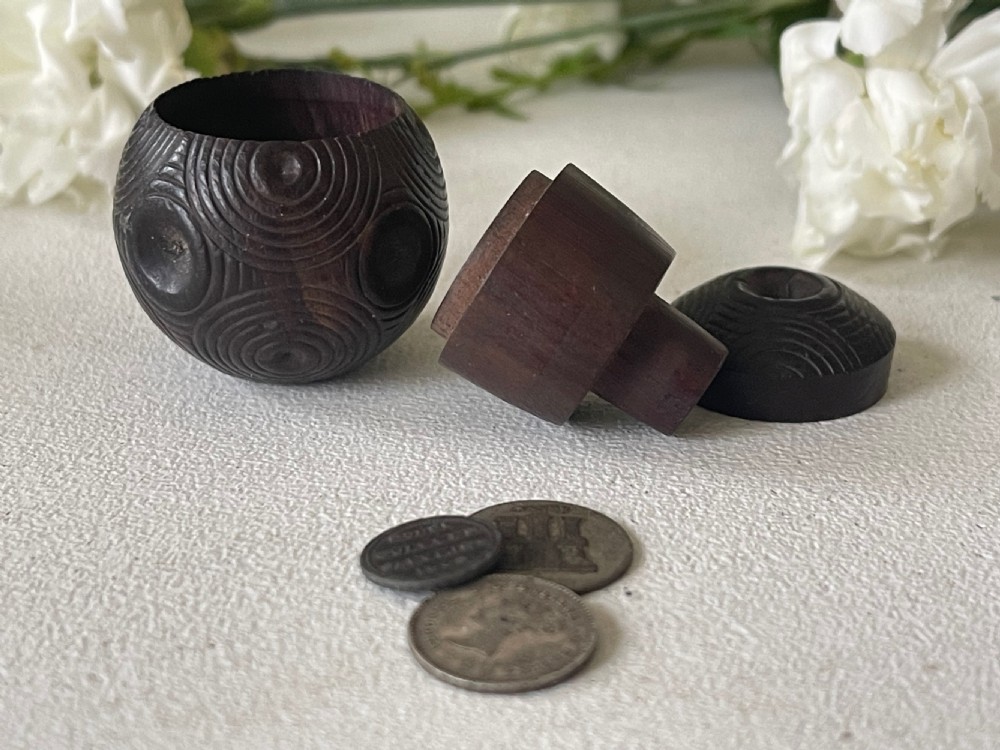 A Mini Antique Treen Puzzle Ball - with three old coins inside