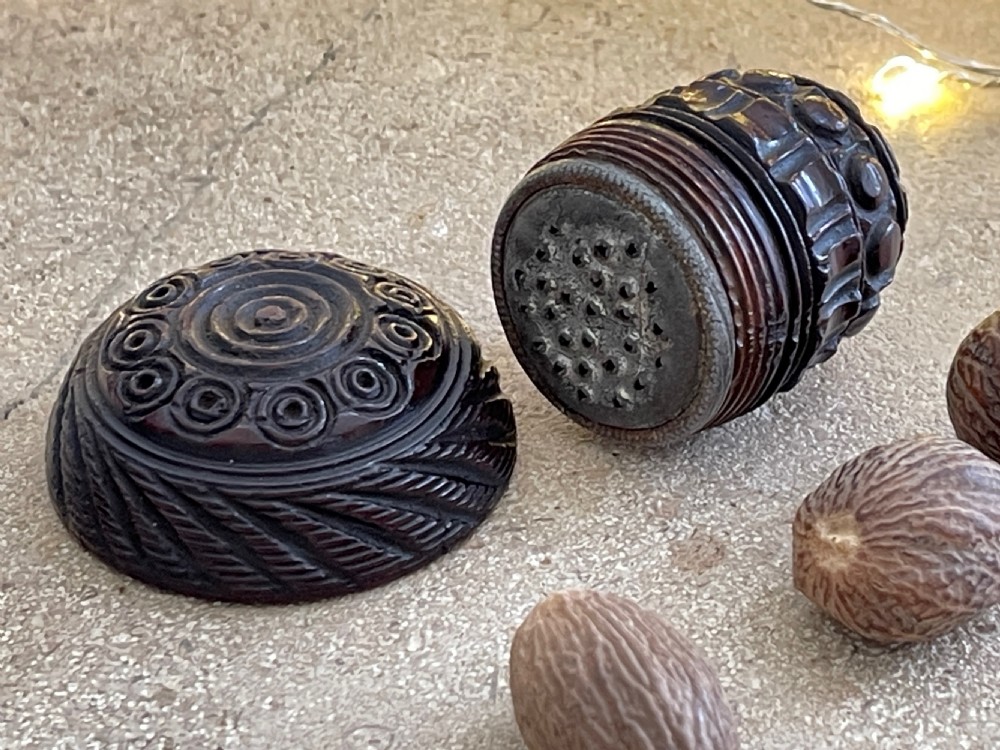 An Antique Treen Coquilla Nutmeg Grater - intricately carved