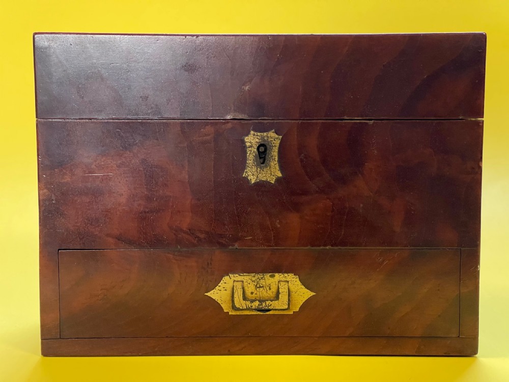 A lovely flame mahogany apothecary case -with contents
